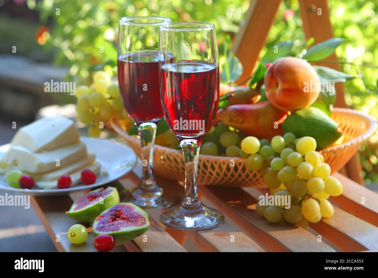 Still life with red wine and fruits Stock Photo - Alamy