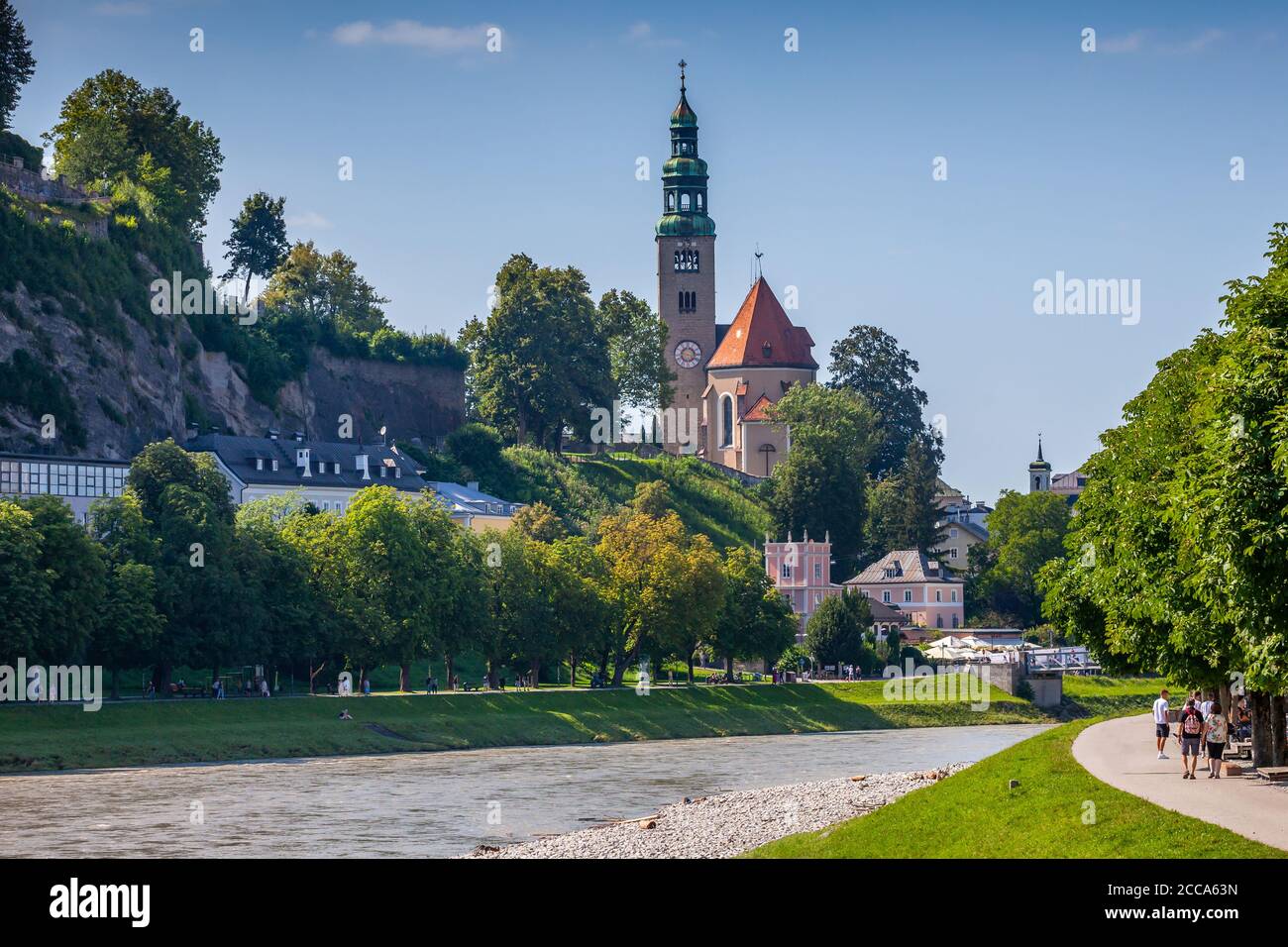 Riverbank of Salzach river and Catholic Church (Pfarre Mülln) in