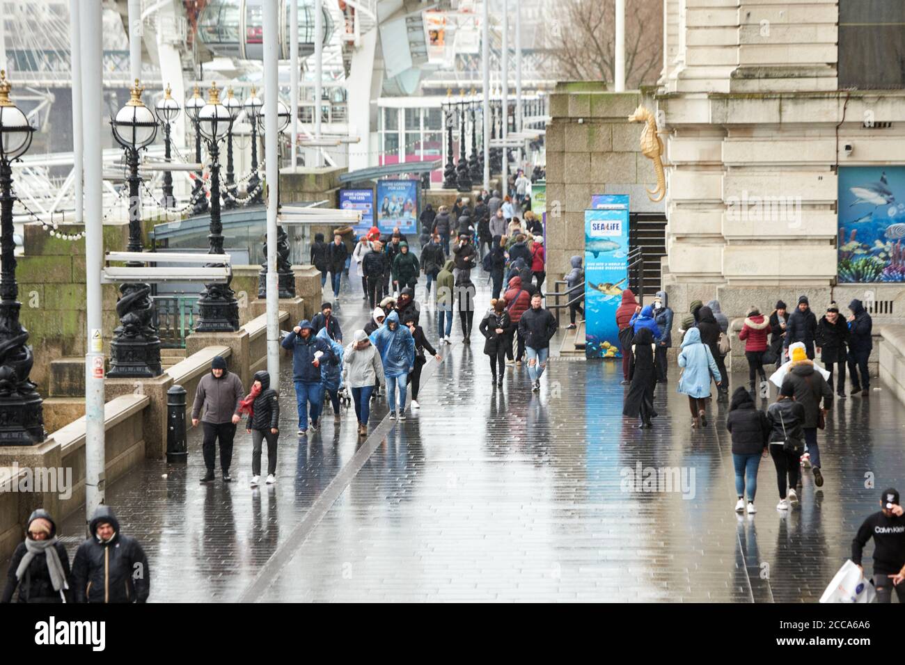 People battle the weather on the South Bank in London during high winds and  rain caused by Storm Ciara Stock Photo - Alamy