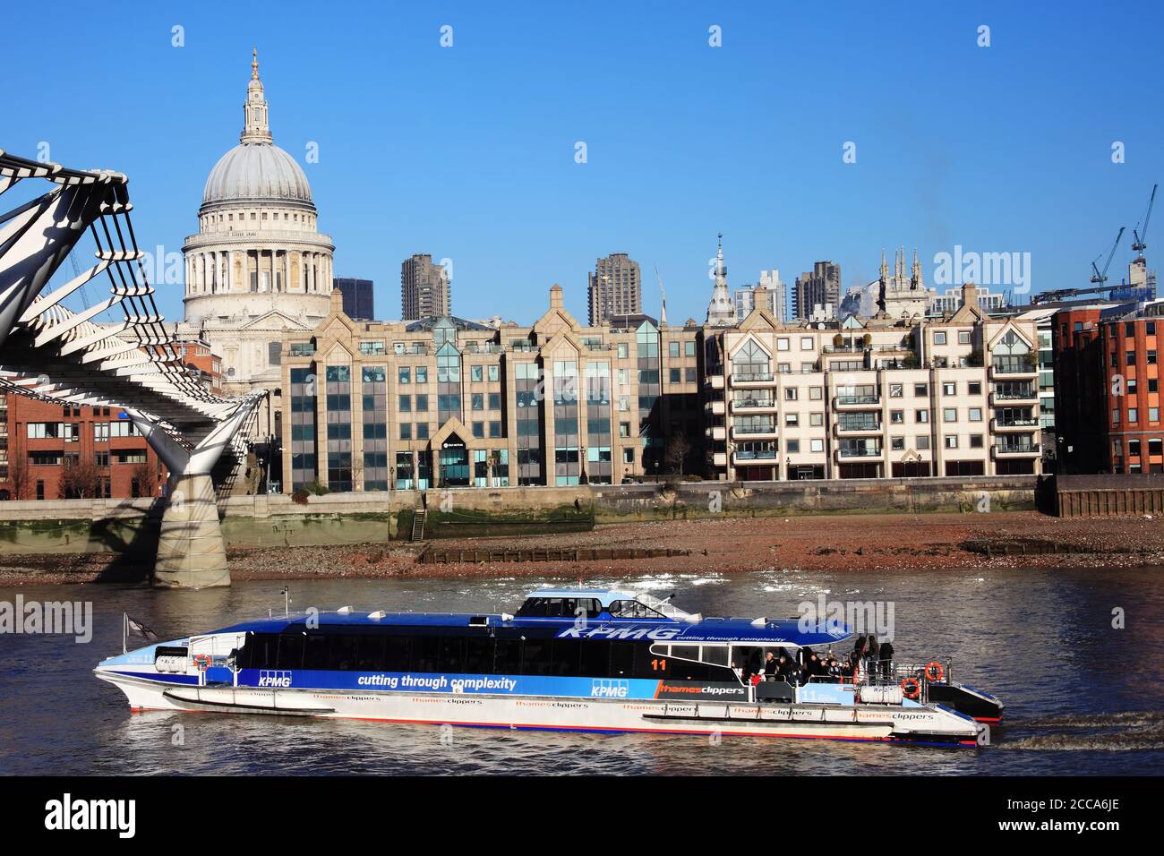 London, UK, January 14, 2012 : Thames Clipper public transport waterbus boat trip on the River Thames by St Paul's Cathedral which is a popular travel Stock Photo