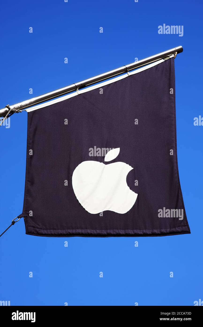 London, UK, April 1, 2012 : Apple computers logo sign flag flying outside their flagship retail business department store in Regents Street which is a Stock Photo