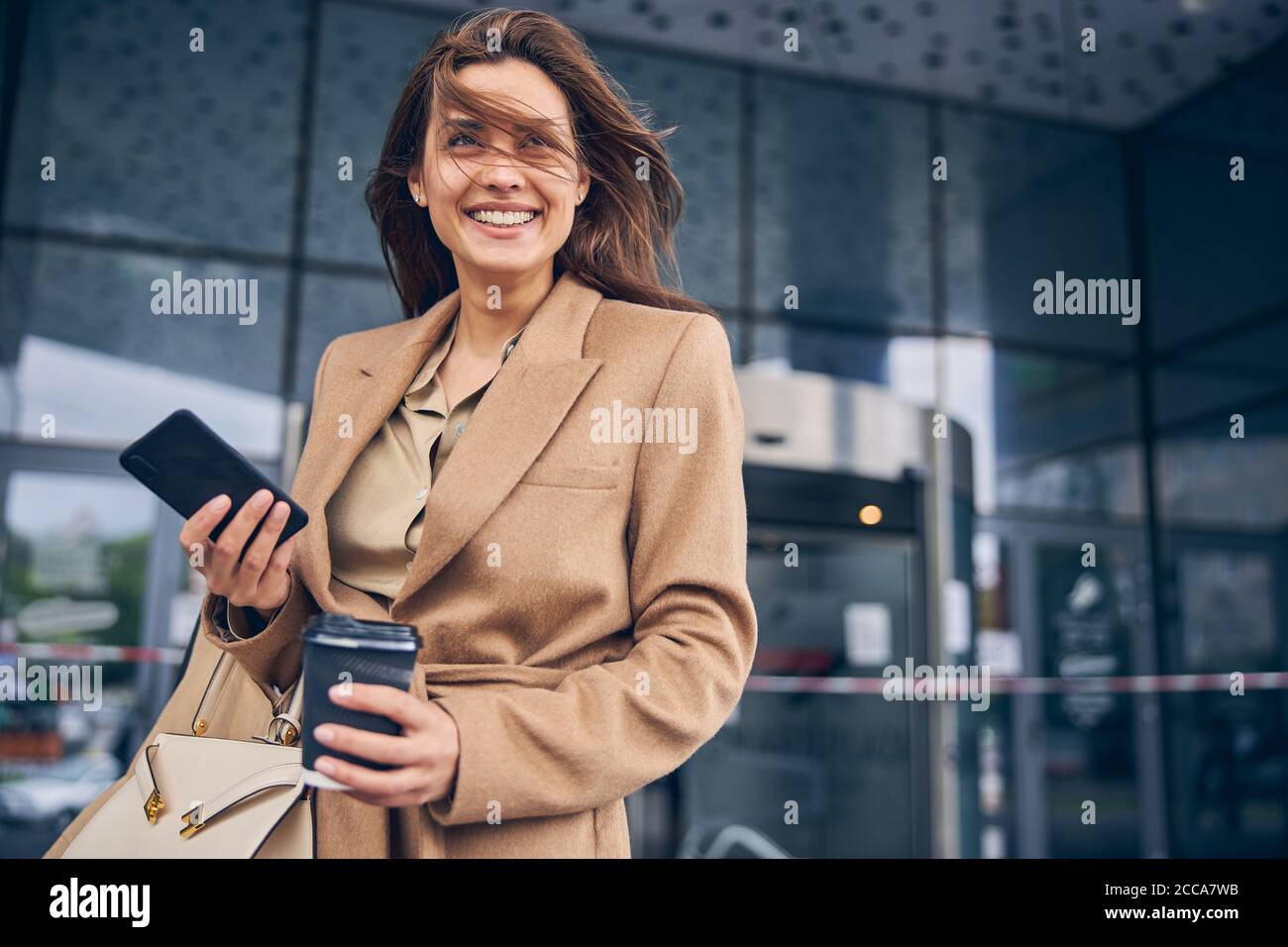 Pleased business lady staring into the distance Stock Photo