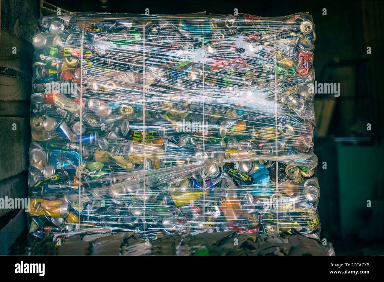 Large container full of compressed aluminium cans. Recycling garbage