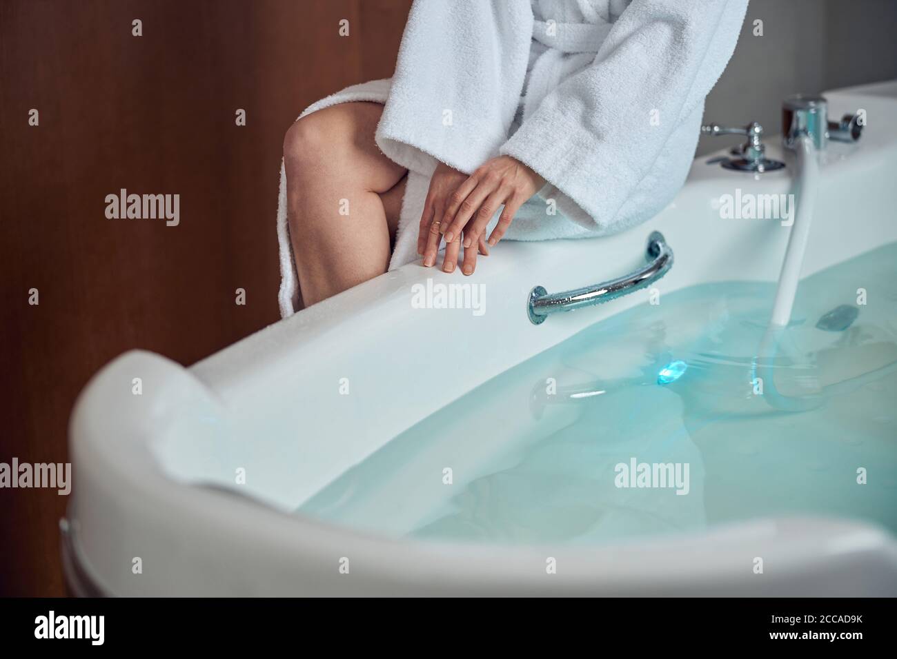 Woman getting ready for a water procedure Stock Photo