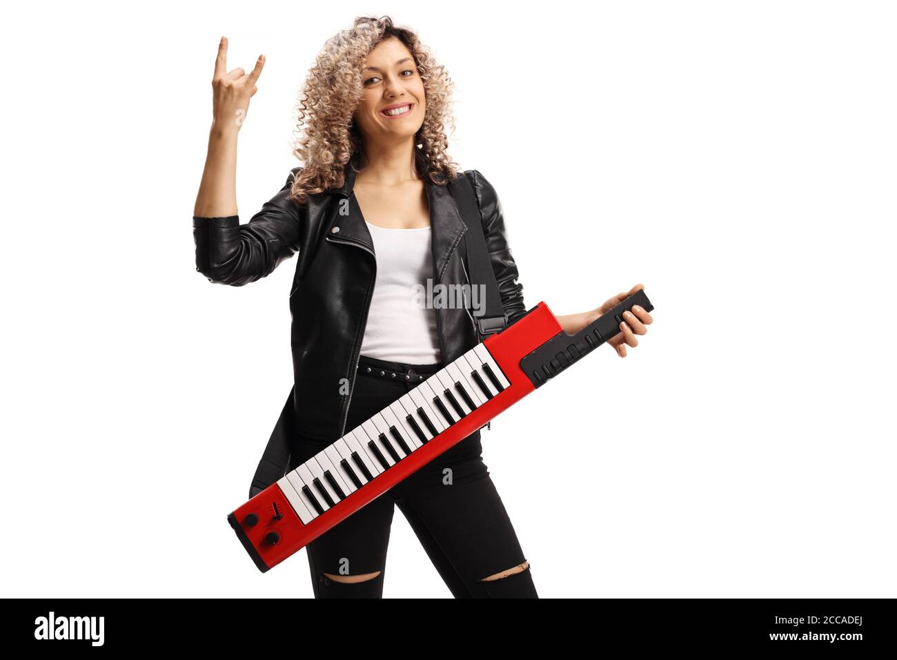 Female musician with a curly blond hair with a keytar synthesizer gesturing rock and roll sign isolated on white background Stock Photo