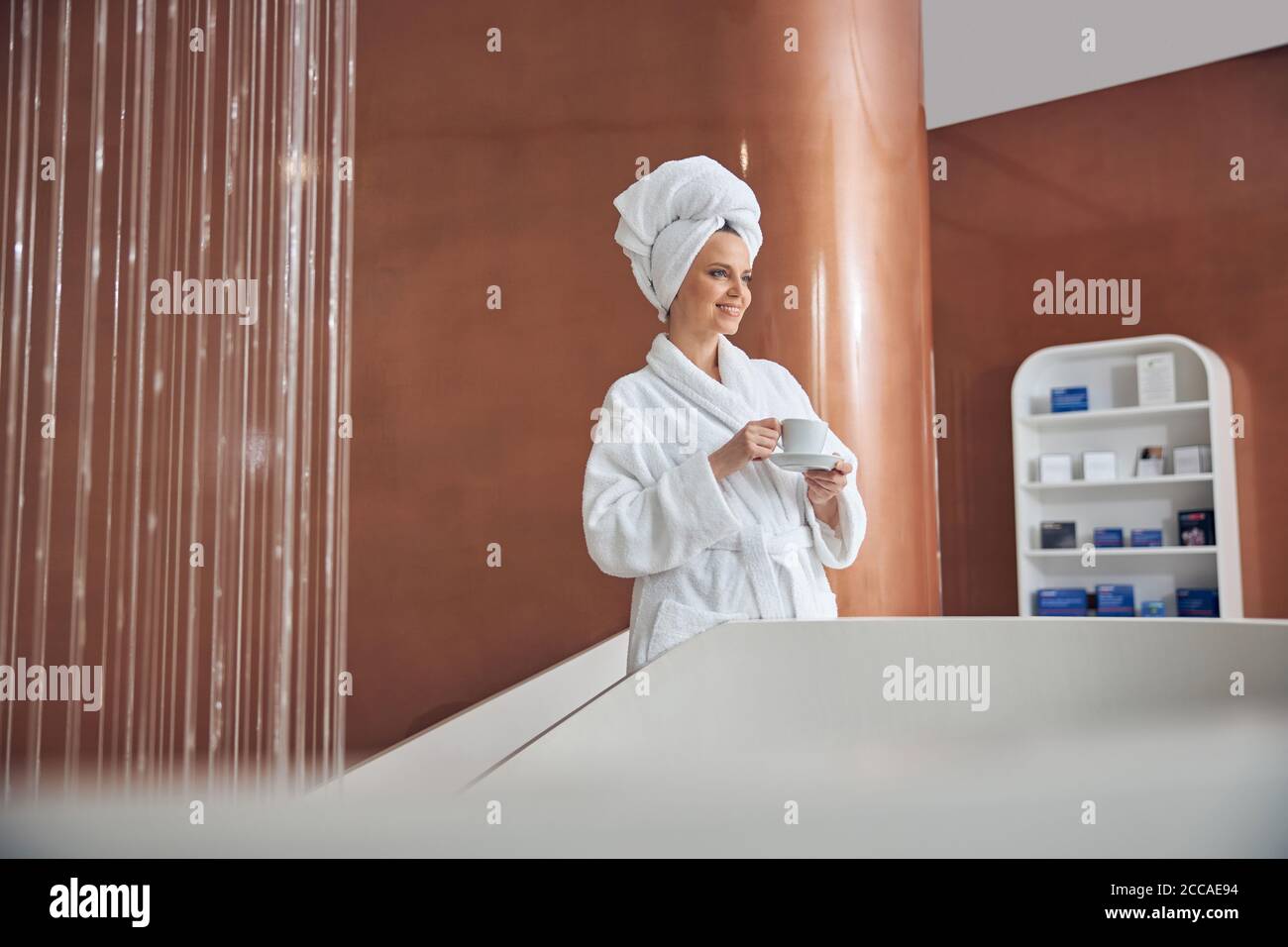Dreamy lady holding a cup of tea Stock Photo