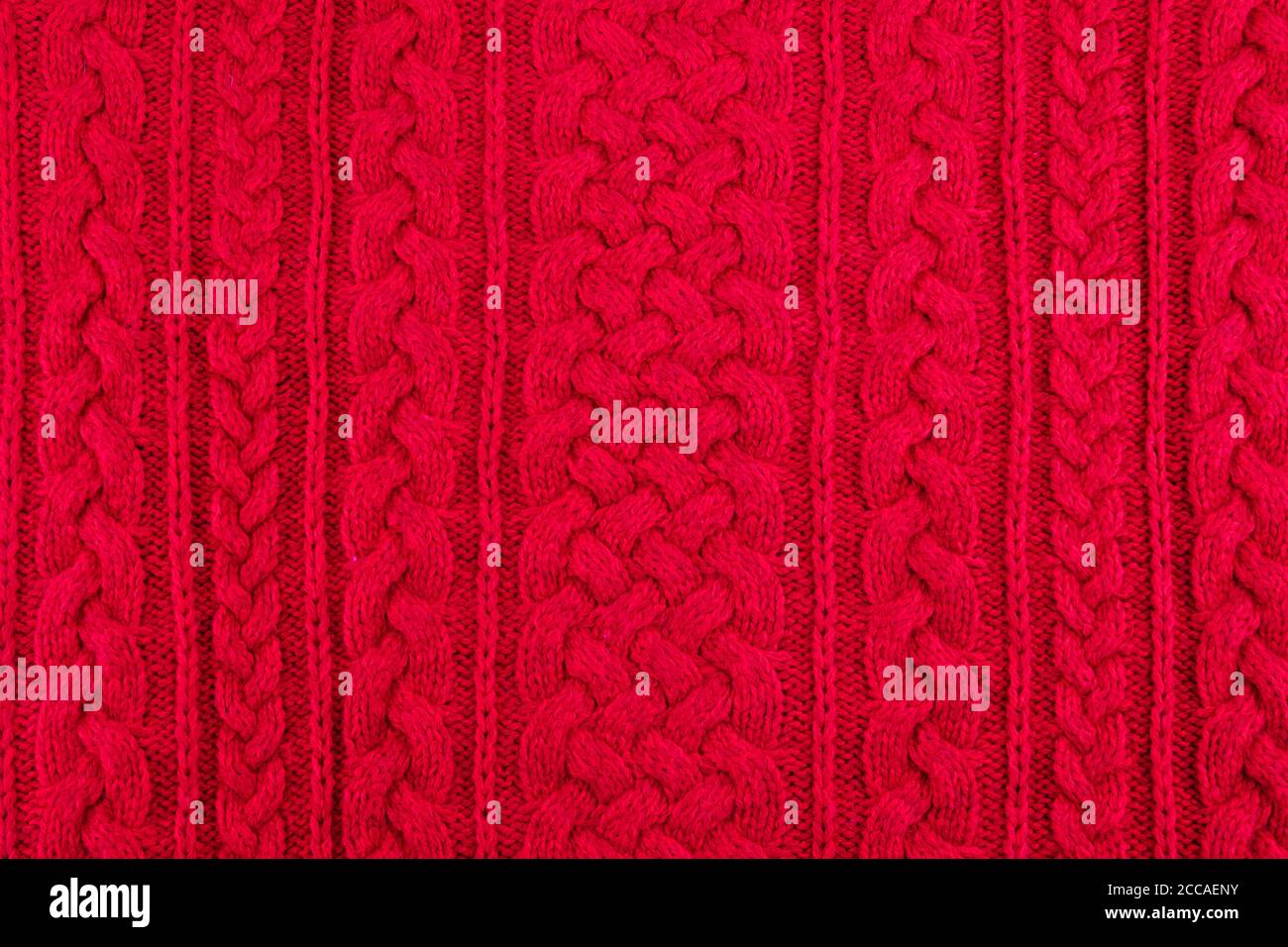 background texture red knitting cable rib pattern Stock Photo - Alamy