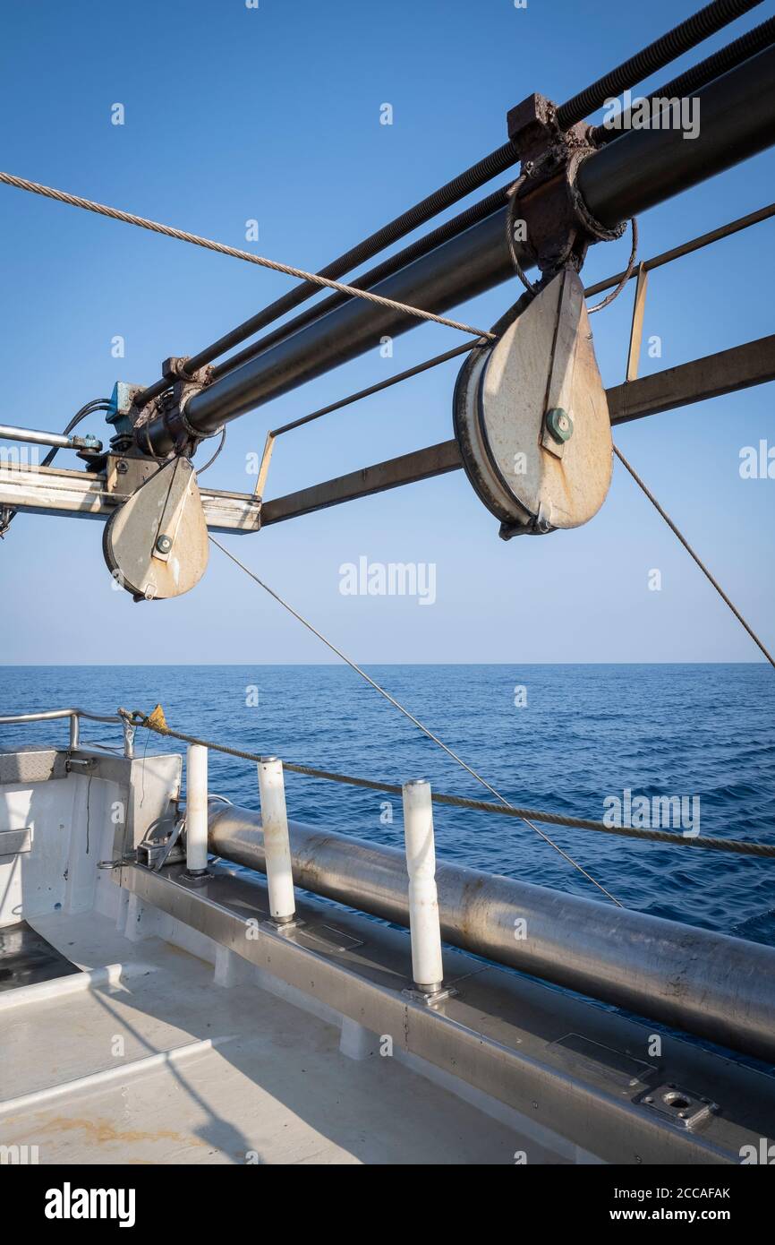 Cables holding a trawl while it is submerged in the sea. Costa Brava. Catalonia. Spain. Stock Photo