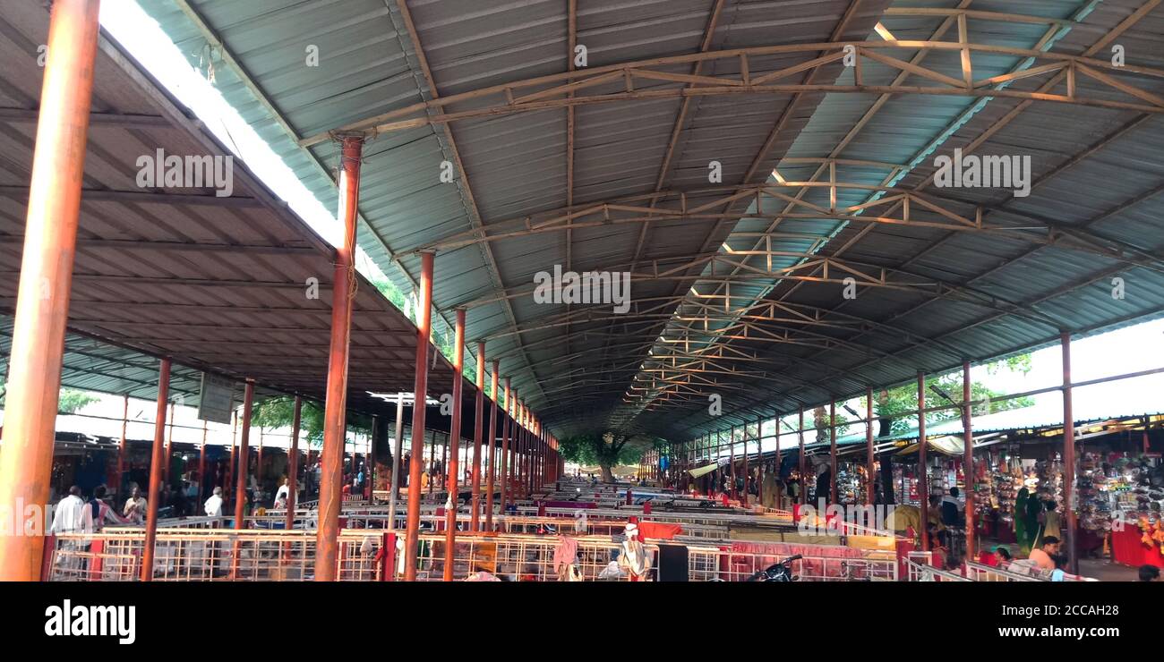 DISTRICT SATNA, MAIHAR CITY, INDIA - SEPTEMBER 12, 2019: Maihar temple premises area out side with ceiling and vehicle stand at open background. Stock Photo