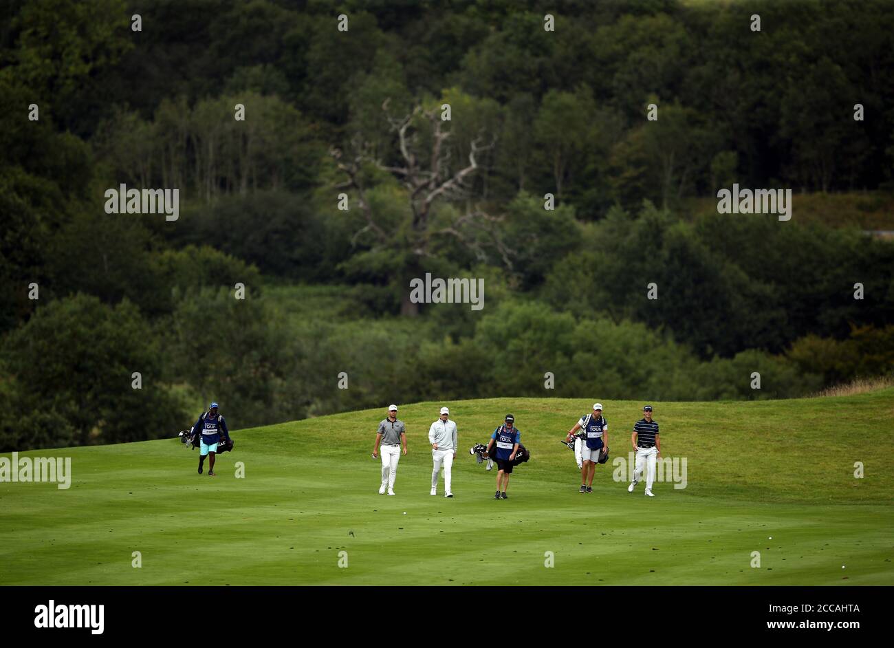 The group of Joachim Hansen, Kristoffer Reitan and Louis De Jager make their way down the sixteenth fairway during day one of the ISPS Handa Wales Open at Celtic Manor Resort. Stock Photo