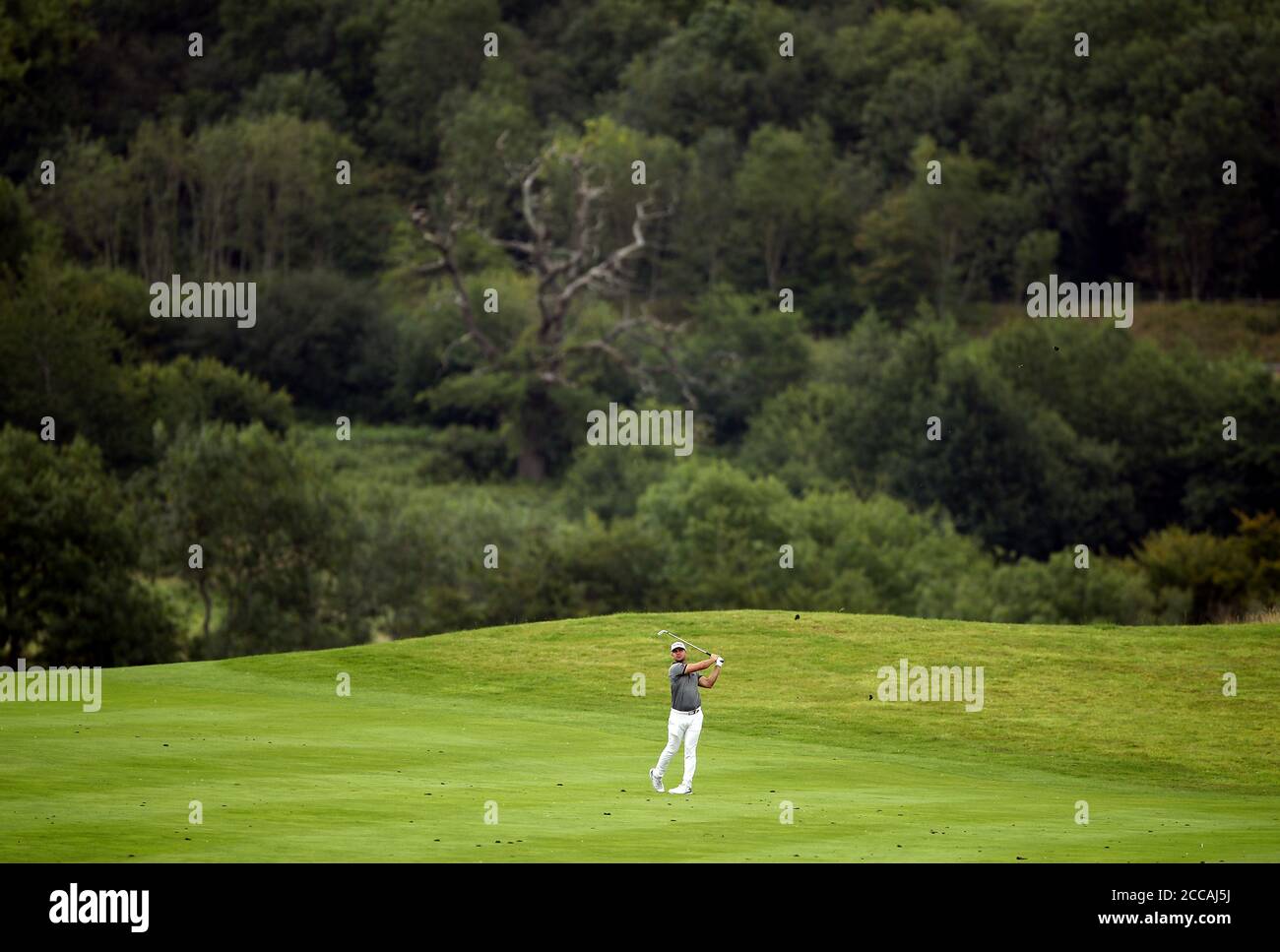 South Africa’s Louis De Jager plays down the sixteenth fairway during day one of the ISPS Handa Wales Open at Celtic Manor Resort. Stock Photo