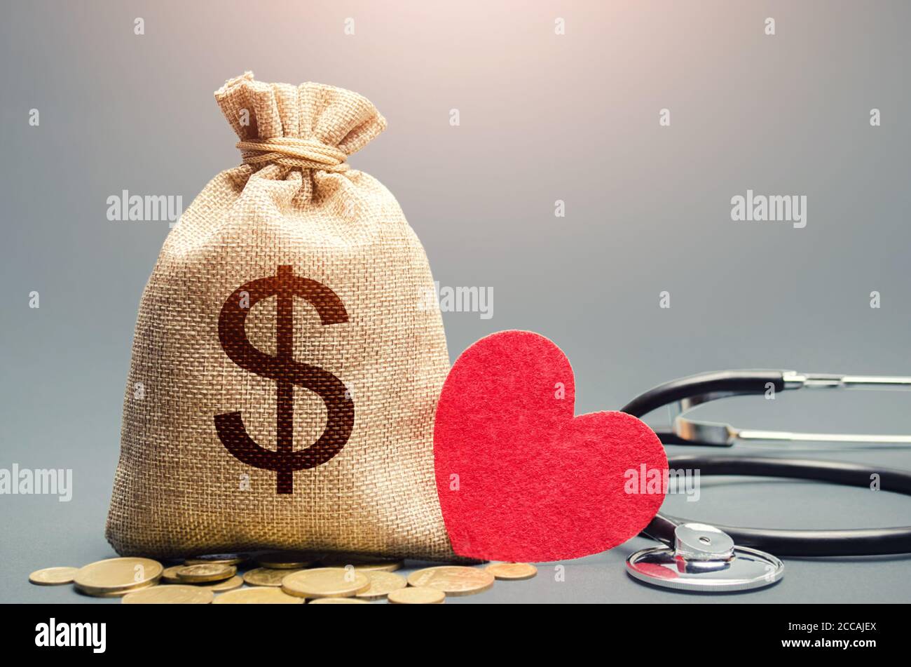 Dollar money bag and stethoscope. Health life insurance and financing concept. Funding healthcare system. Reforming and preparing for new challenges. Stock Photo