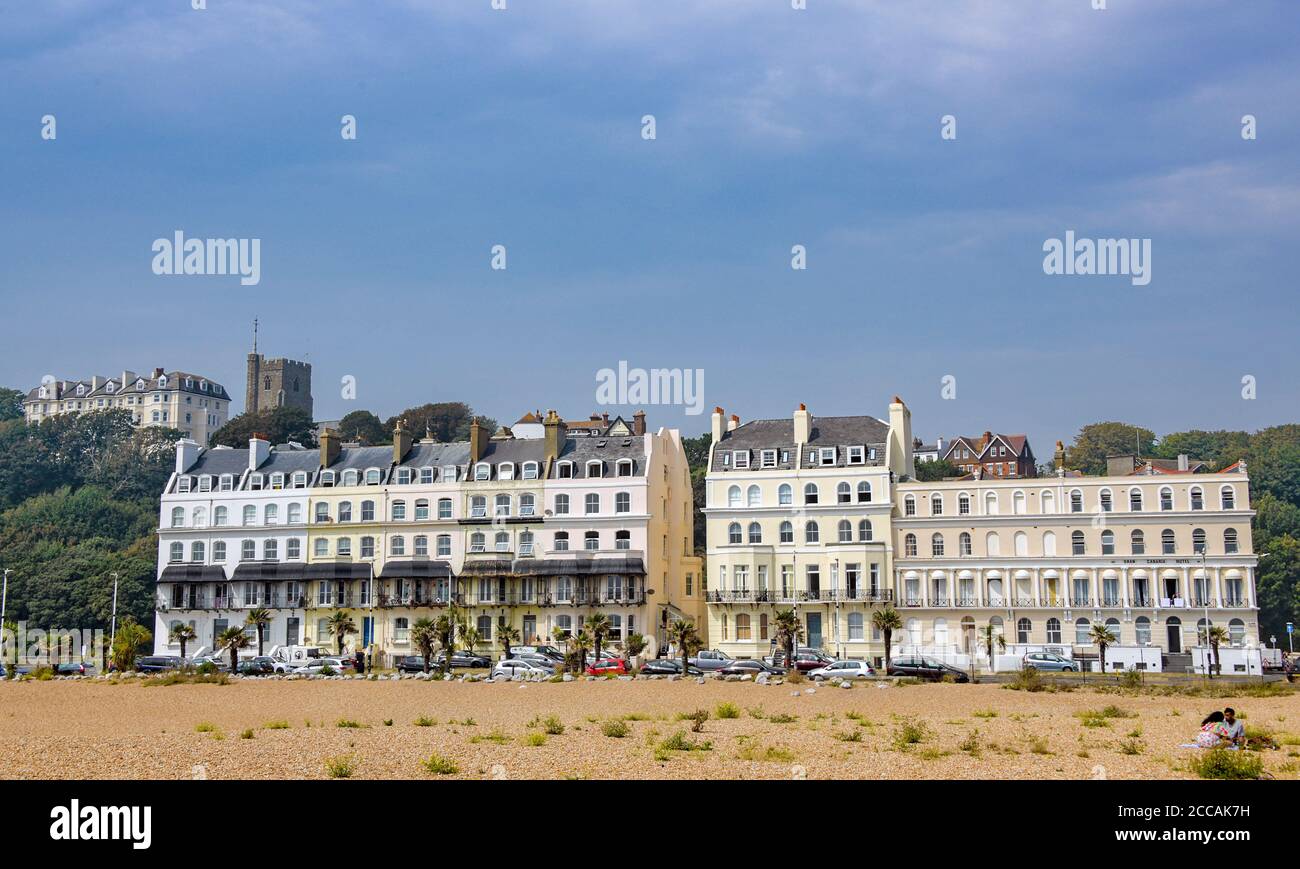 Elegant seafront terraced houses and Church of St Mary & St Eanswythe Folkestone Kent England Stock Photo