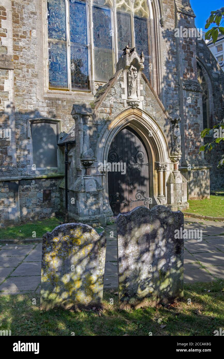 Gravestones and entrance Church of St Mary & St Eanswythe Folkestone Kent England Stock Photo