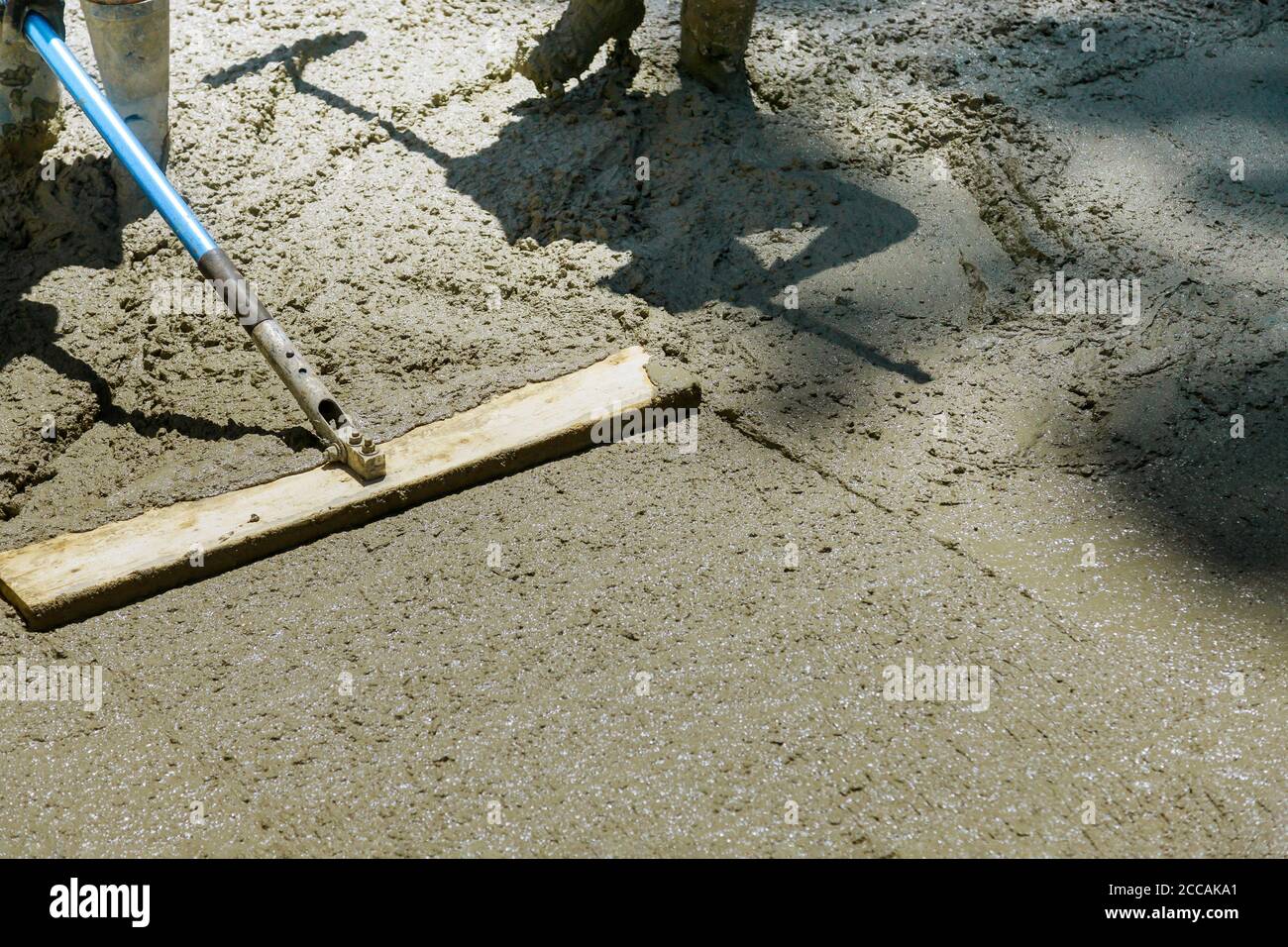 Process of installing construction of new sidewalks laying concrete