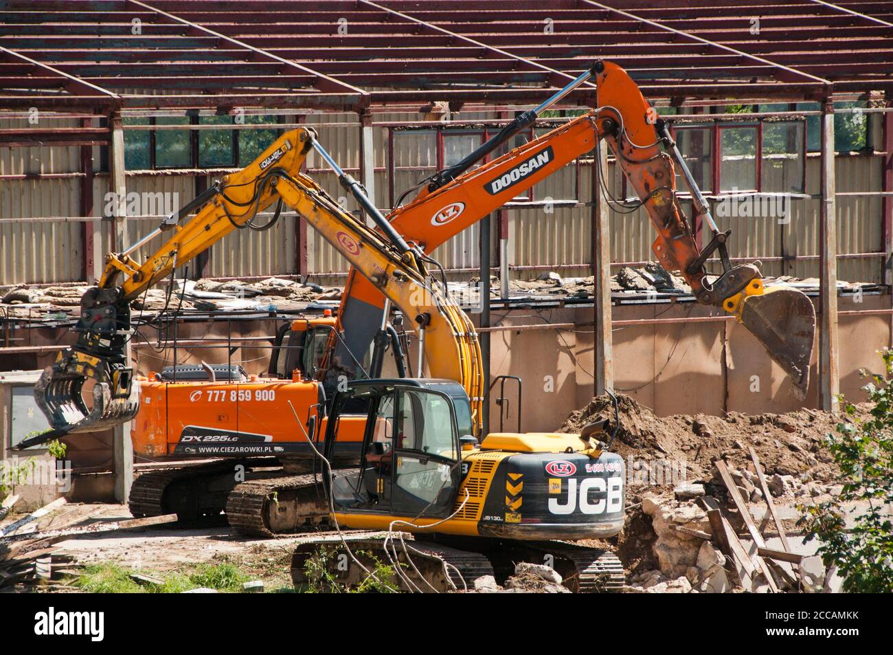 excavators working at a demolition site Stock Photo Alamy