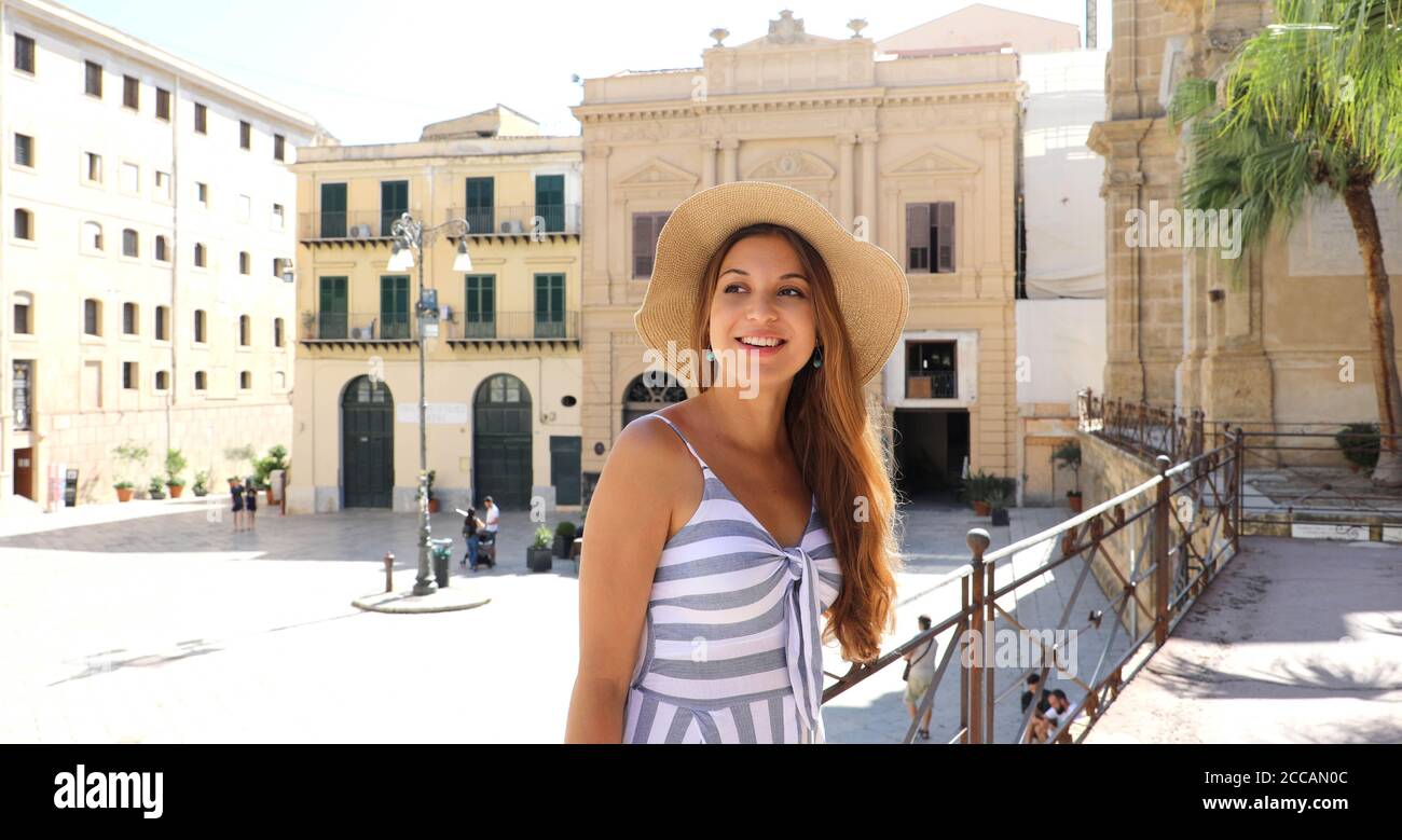 Beautiful smiling tourist woman visiting the old town of Palermo in Sicily, Italy Stock Photo