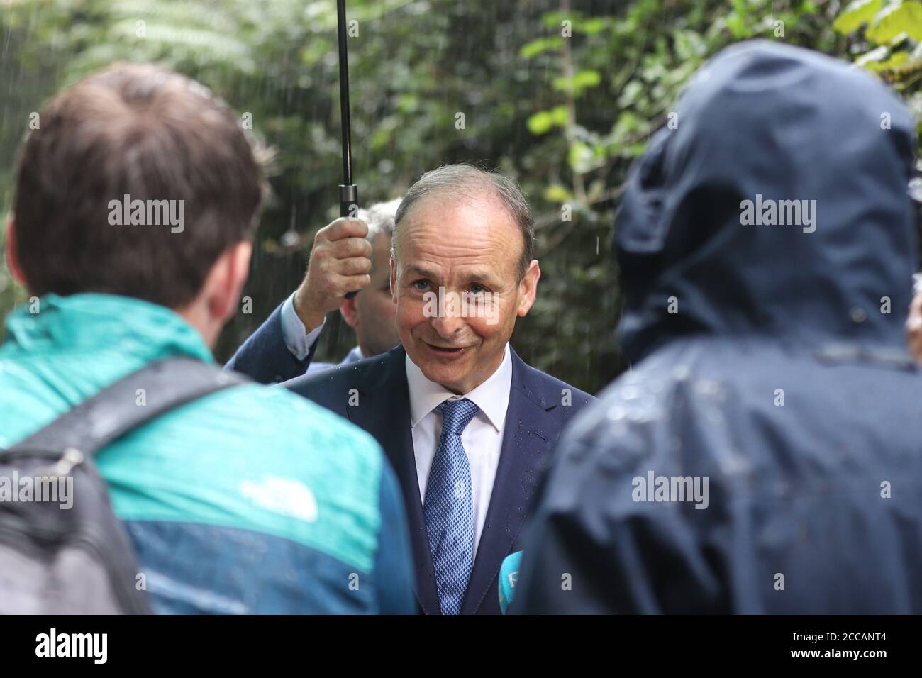 An Taoiseach Micheal Martin takes questions from the media as he visits the flood damaged houses and businesses of Skibbereen after a flood caused extensive damage to a number of premises in the popular Irish tourist town. Photo Damien Storan. Stock Photo