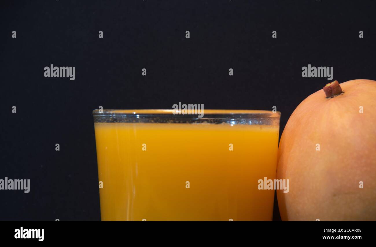 Mango juice (Mangifera indica). Tropical fruit. Fruit rich in fiber