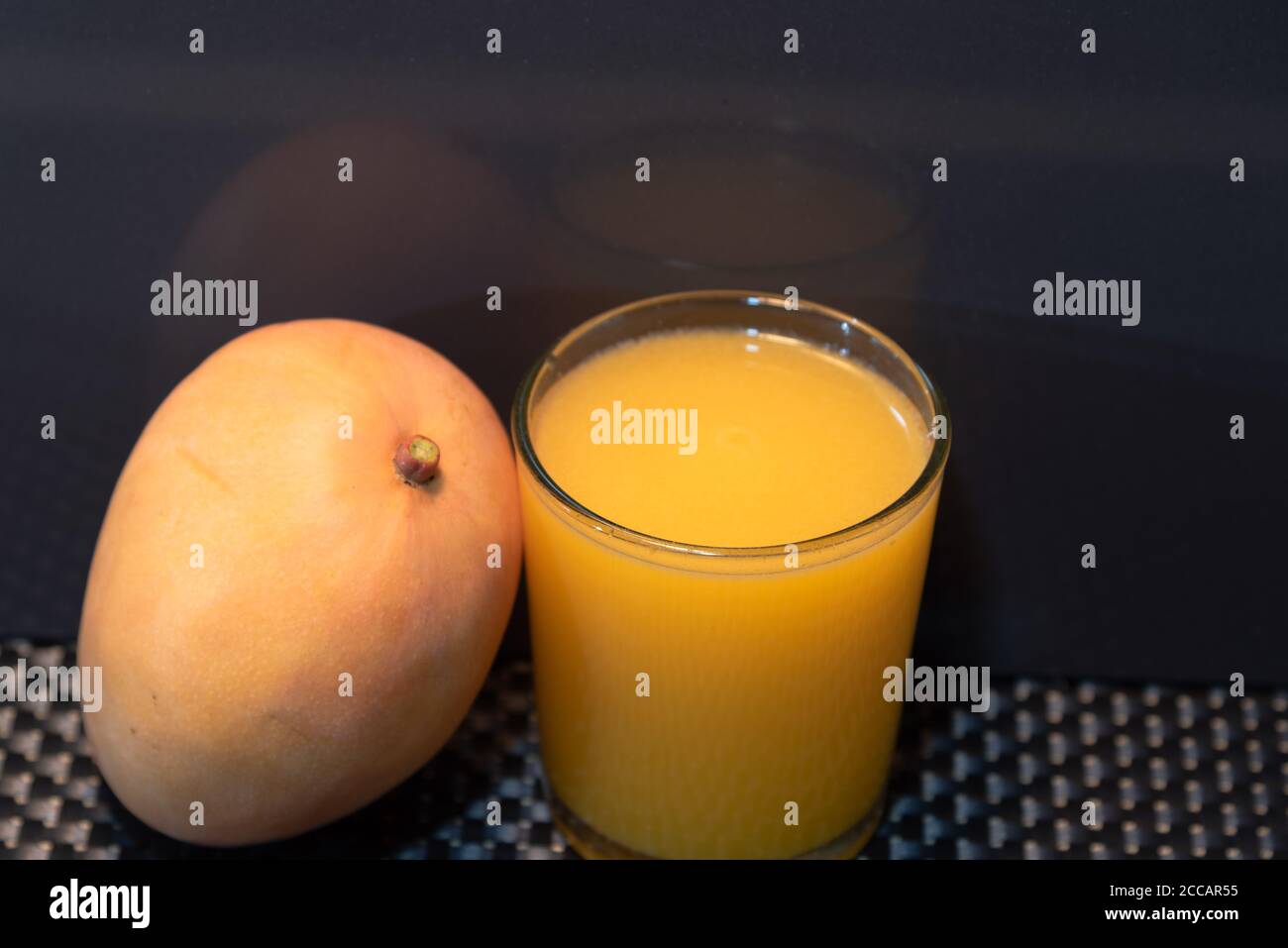 Mango juice (Mangifera indica). Tropical fruit. Fruit rich in fiber