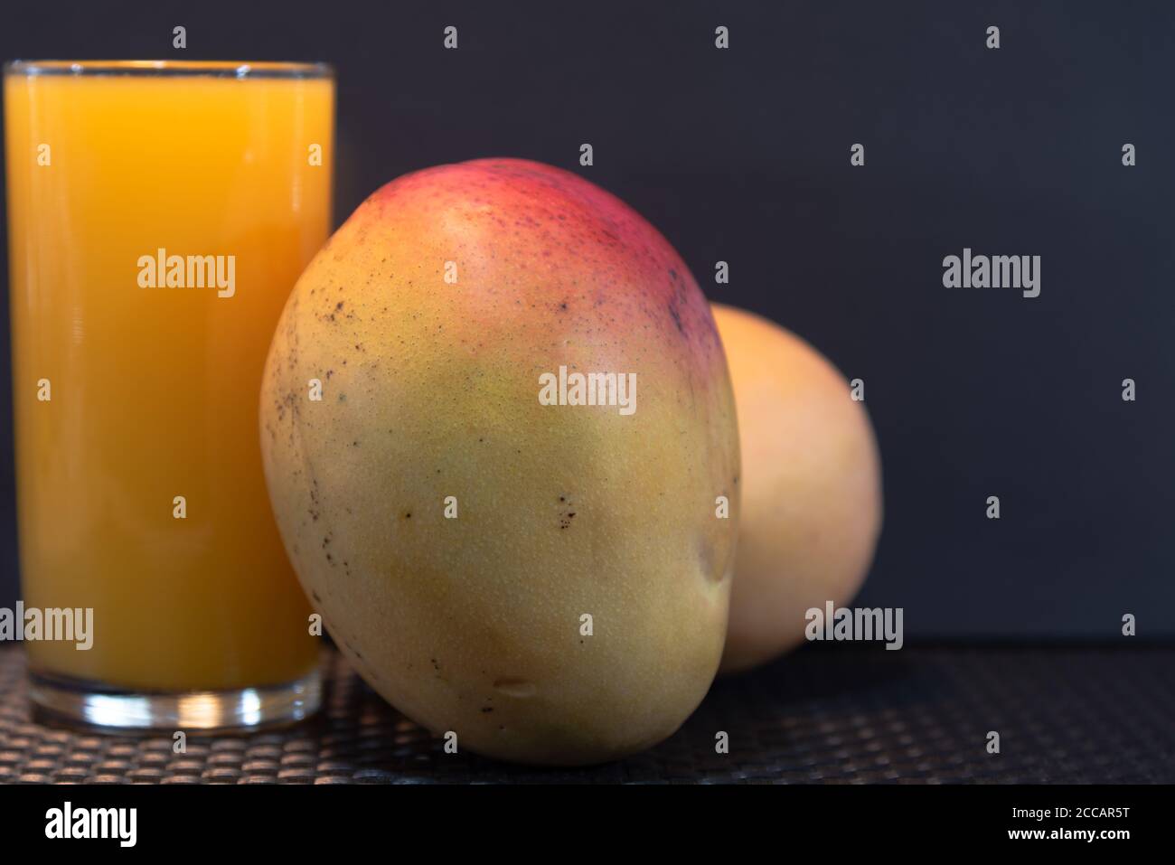 Mango juice (Mangifera indica). Tropical fruit. Fruit rich in fiber