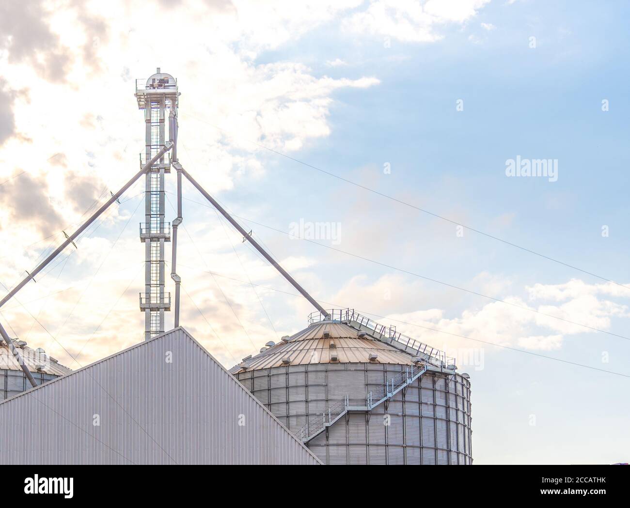 Metallic warehouse. Grain storage silo. Soy deposit. Infrastructure for storage and storage of agricultural products. Agriculture in Brazil. Grain war Stock Photo