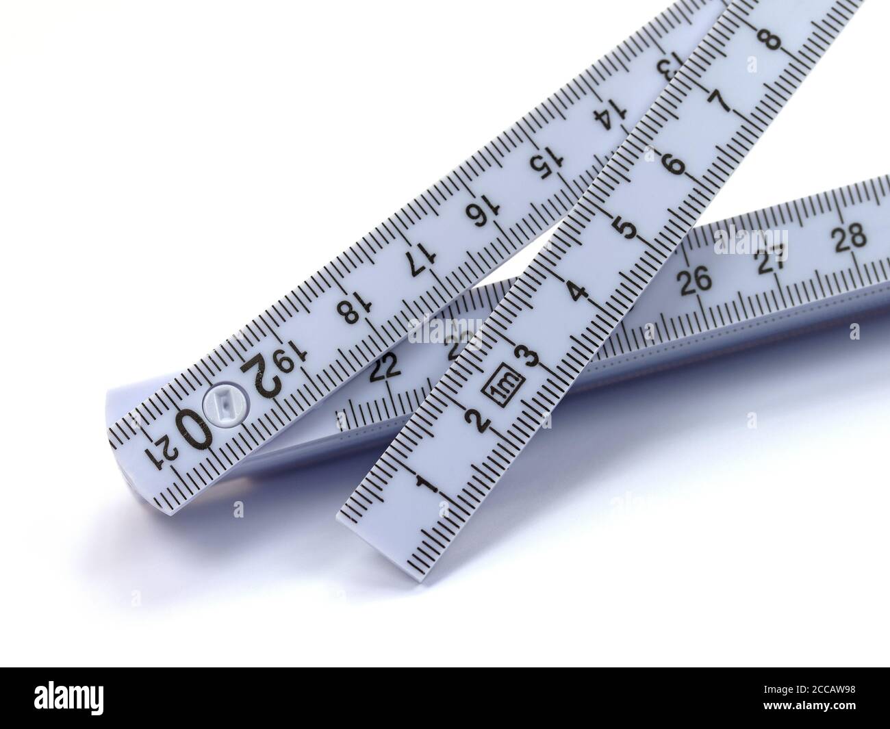 Folding rule against white background Stock Photo Alamy