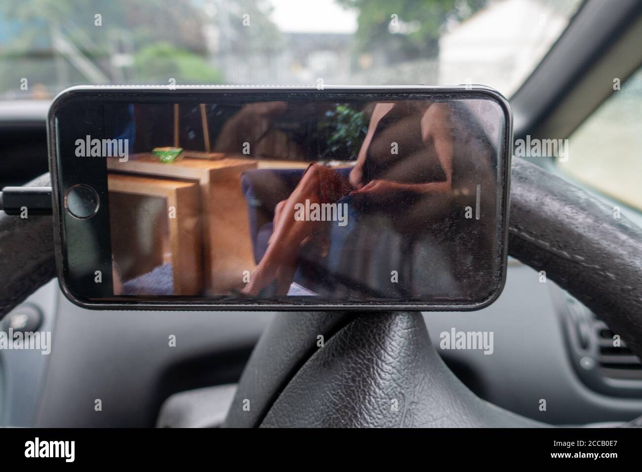 Iphone 6s With Tv Drama Showing On The Screen In A Car Stock Photo Alamy
