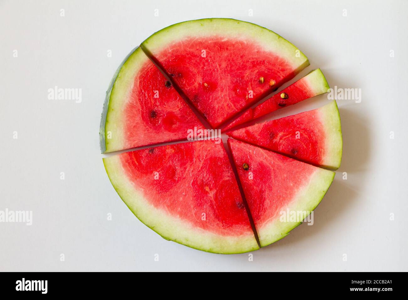 Few slices of ripe watermelon on white background, top view Stock Photo