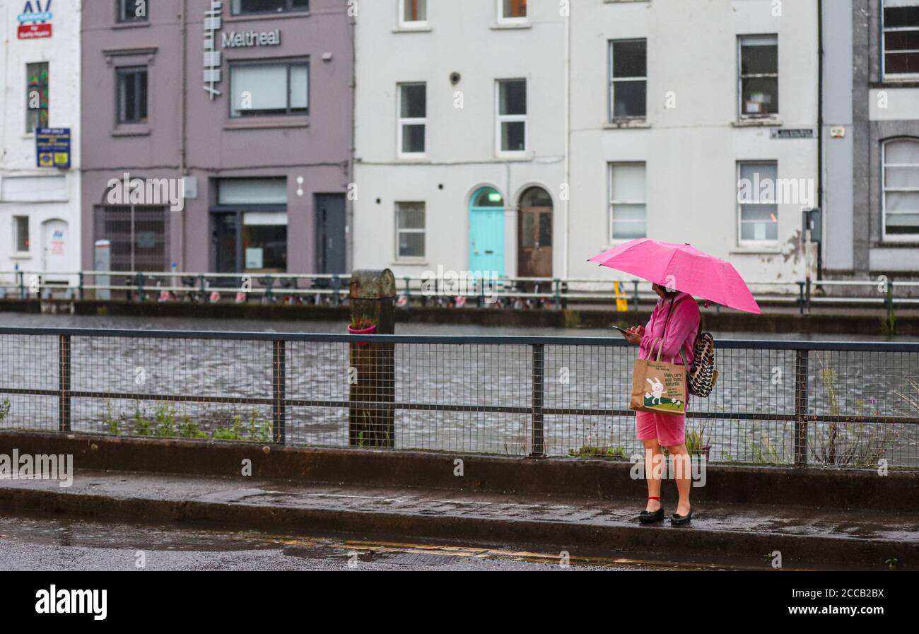 Cork Raining Locals brave the torrential rain and flooding in Cork city centre on ...