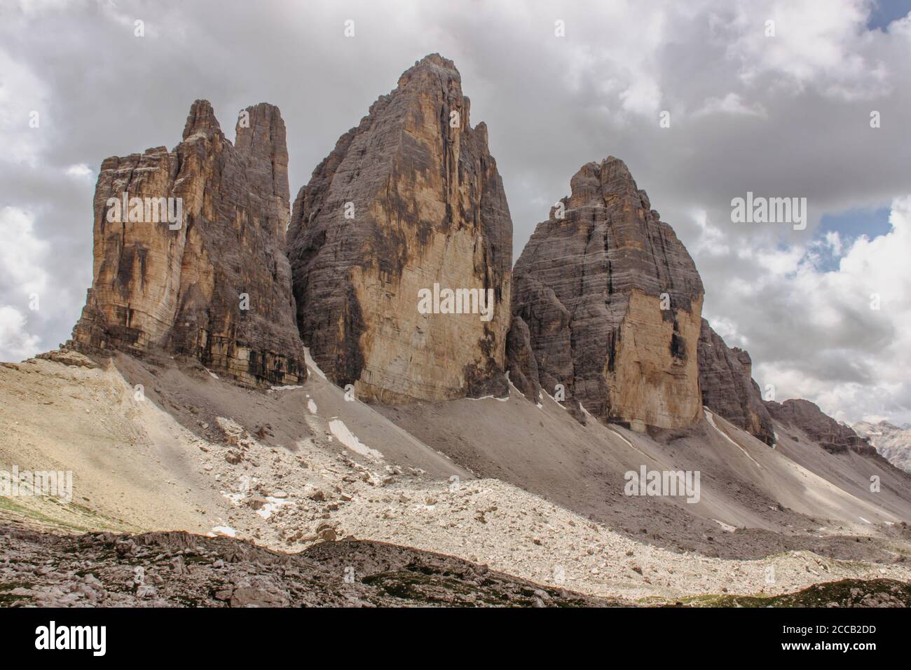 Hiking around three peaks of Tre Cime di Lavaredo (Drei Zinnen), Dolomites, Italy. One of the best-known mountain groups in the Alps. Active healthy l Stock Photo