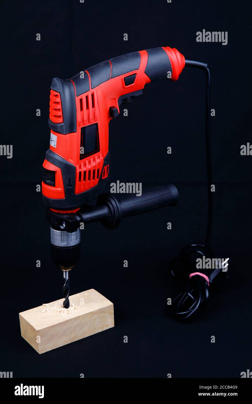 An electric drill isolated on black background Stock Photo