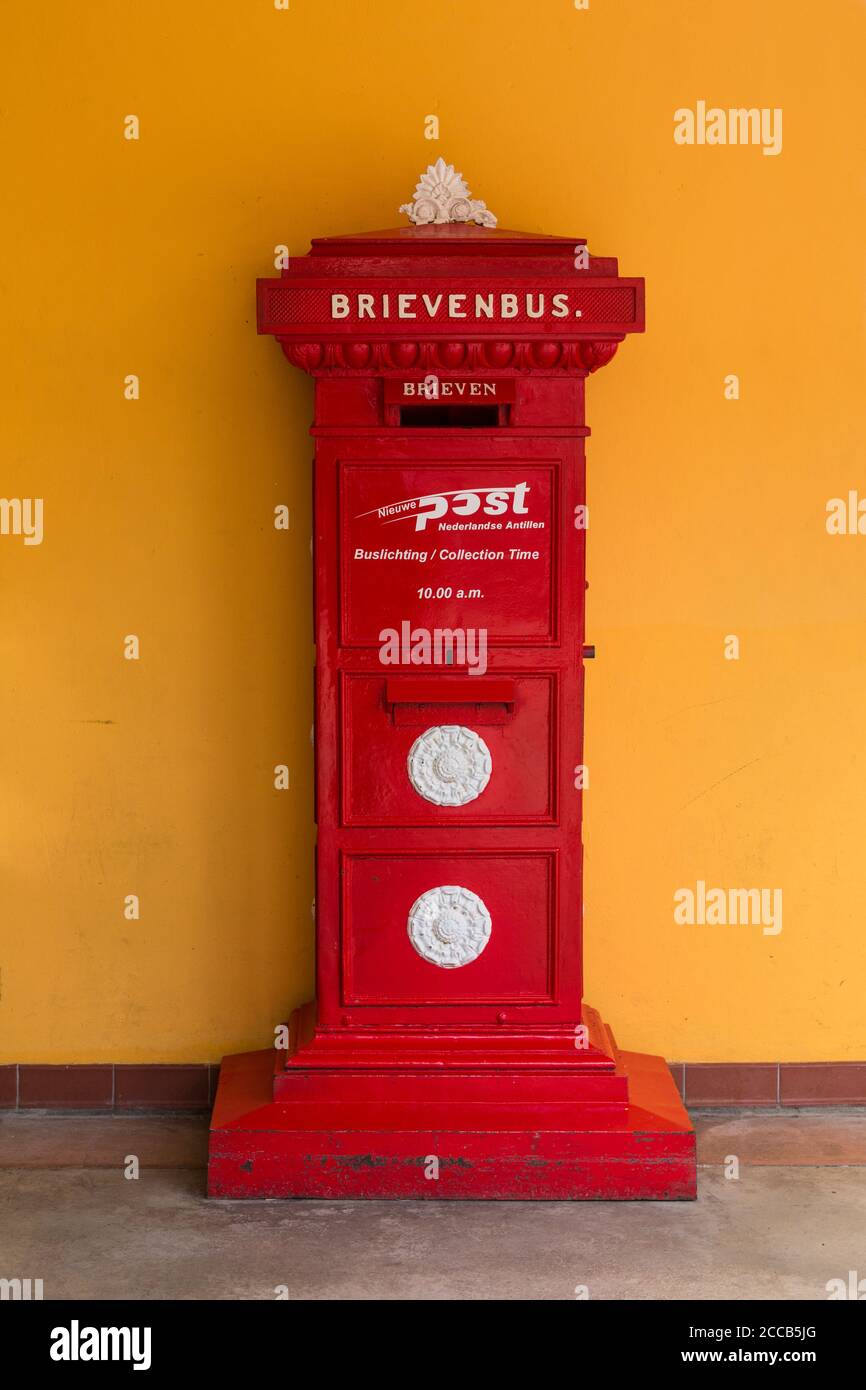 A red post box on the island of Curacao in the Netherlands Antilles in the Caribbean. Stock Photo