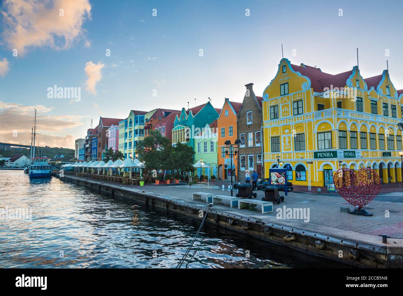 Early morning view of the Punda waterfront in Willemstad, the capital city of Curacao.  Traditional Dutch colonial-style buildings face the Saint Anna Stock Photo