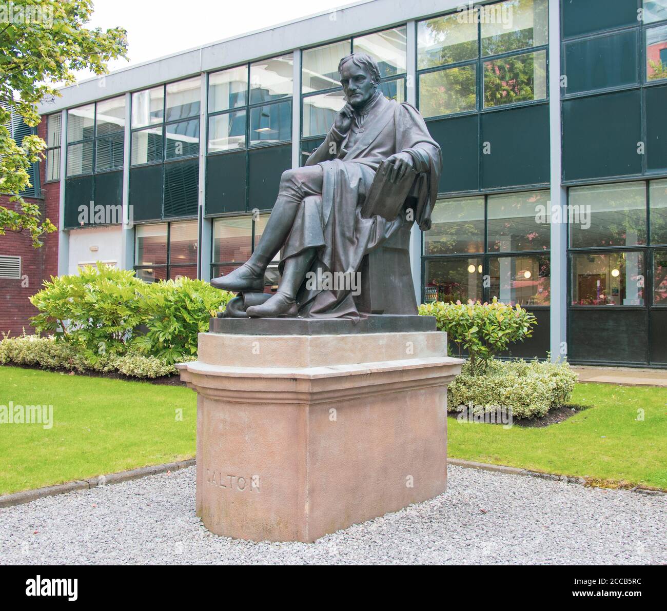 Manchester, United Kingdom - August 17, 2019: Statue of John Dalton outside Manchester Metropolitan University Stock Photo