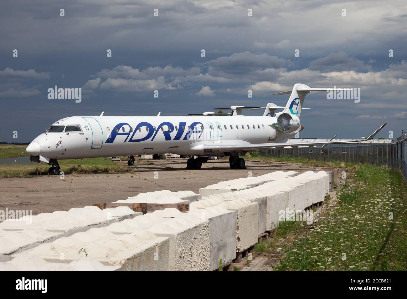 Maastricht, Netherlands. 27th July, 2020. A Bombardier CRJ 900 previously belonged to Adria Airways now stored at Maastricht-Aachen Airport. Credit: Fabrizio Gandolfo/SOPA Images/ZUMA Wire/Alamy Live News Stock Photo