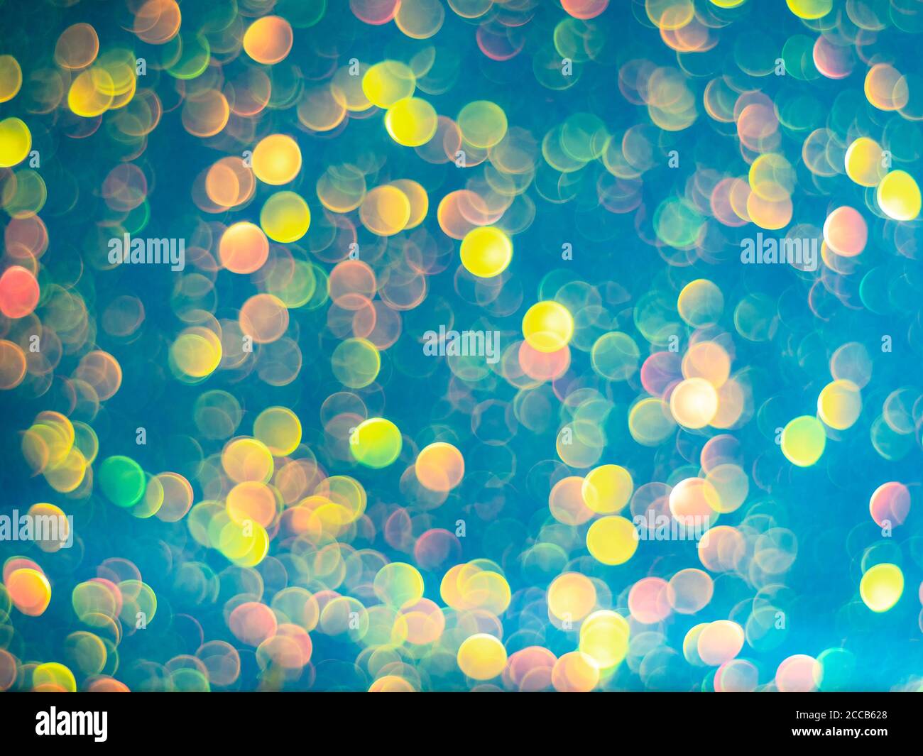 Blue bokeh holiday textured glitter background. Blurred abstract holiday background. Sparkling Glitter bokeh. Stock Photo