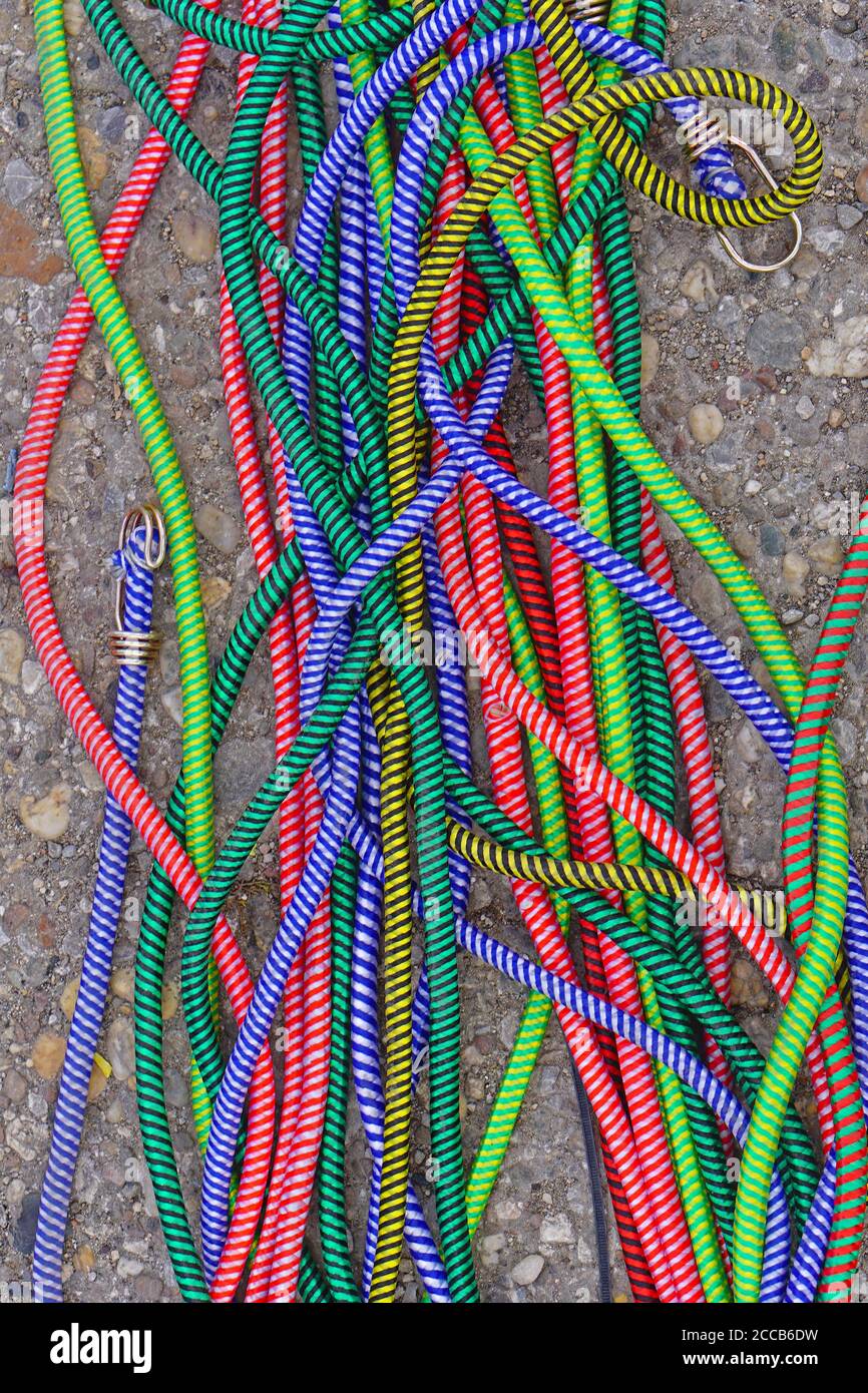 Many various vivid colour bungee ropes cords Stock Photo