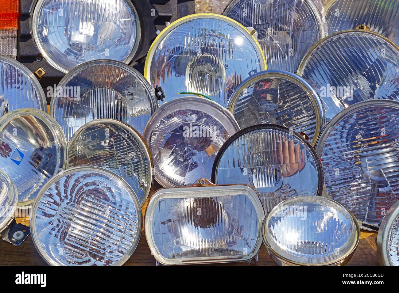 Headlights in various shapes and sizes for cars parts Stock Photo Alamy