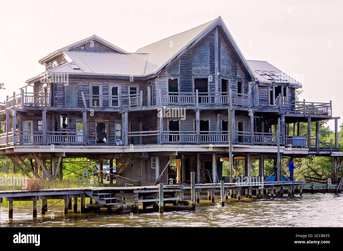 An abandoned house sits on stilts along Fowl River, July 6, 2019, in