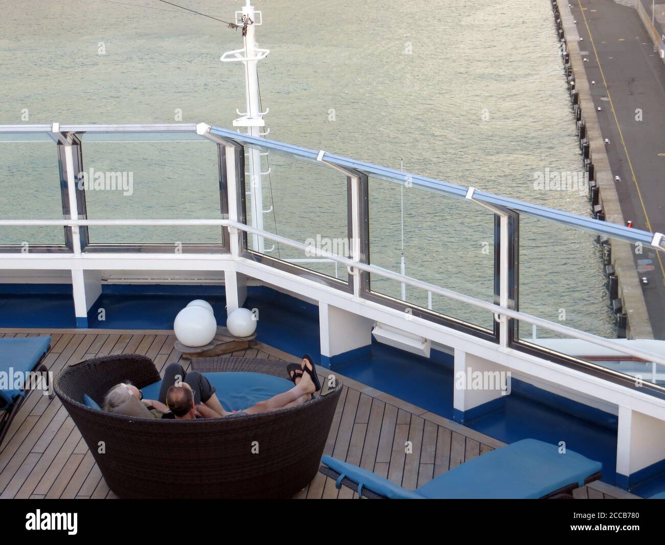 Couple relaxing on a cruise ship deck Stock Photo - Alamy