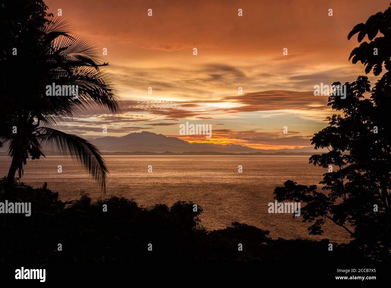 The sun rising over the Golfo Dulce on the Osa Peninsula in Costa Rica. Stock Photo