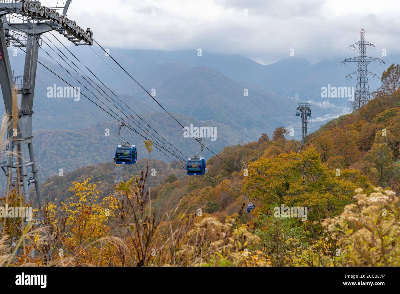 Dragondola (Naeba-Tashiro Gondola) in autumn foliage season. The longest aerial gondola lift line Japan. Naeba, Yuzawa, Niigata Prefecture, Japan Stock Photo