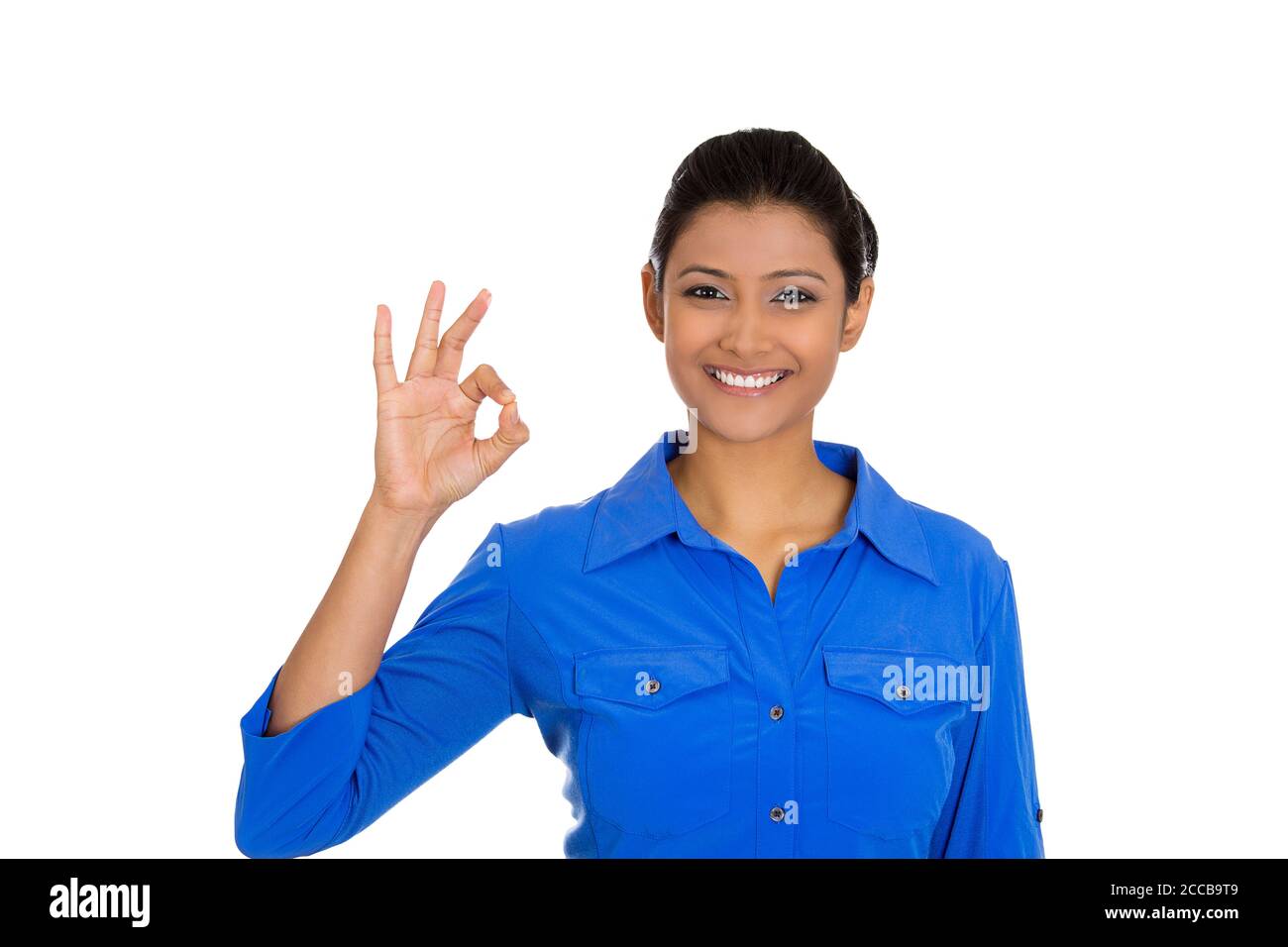 Closeup portrait of young happy, smiling excited beautiful woman giving OK sign with fingers, isolated on white background. Positive emotion facial ex Stock Photo