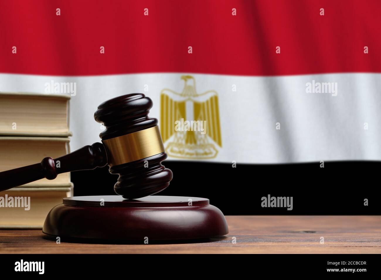 Justice and court concept in Arab Republic of Egypt. Judge hammer on a flag background. Stock Photo