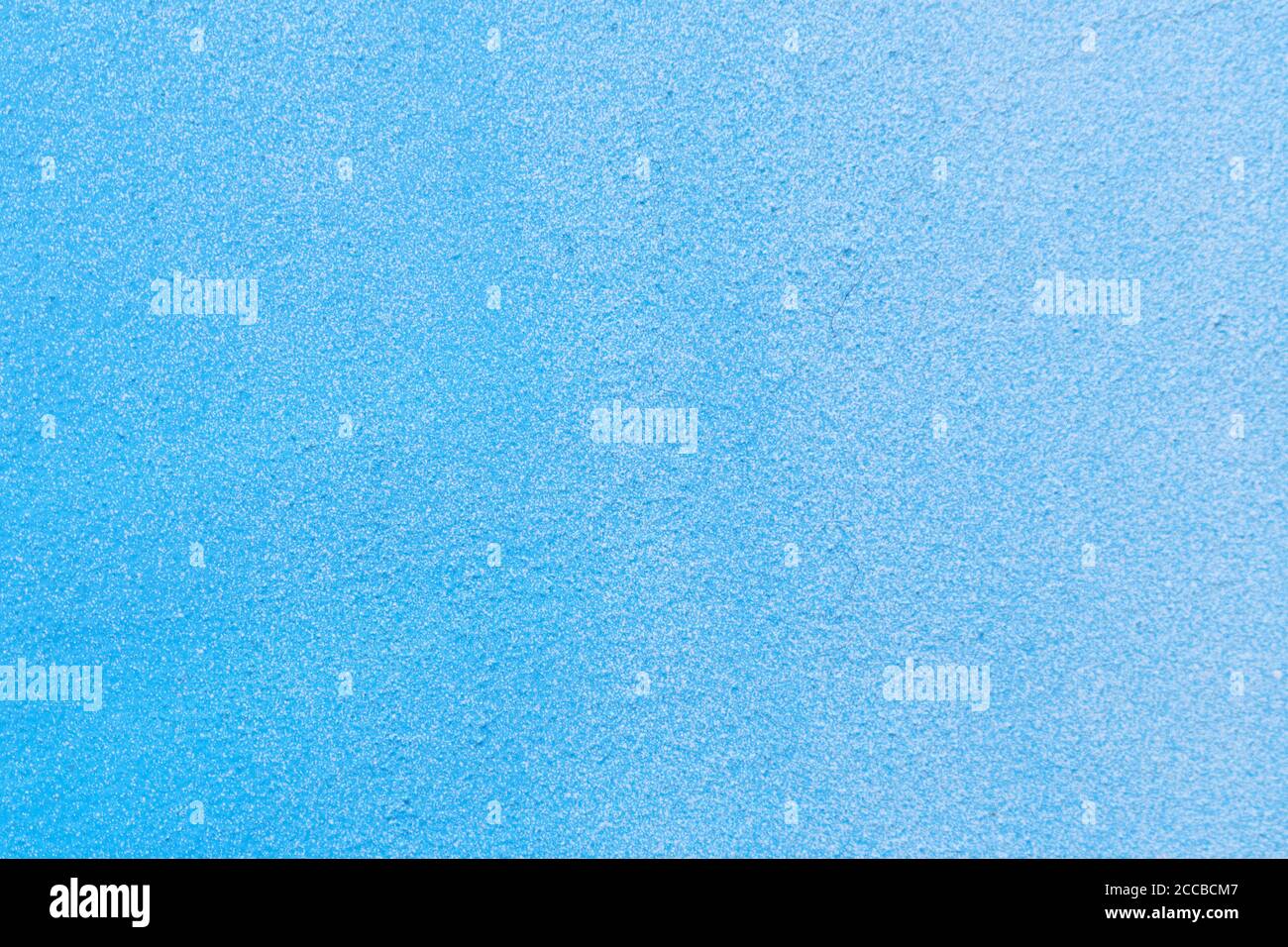 Wall background covered with blue and white gradient. Stock Photo