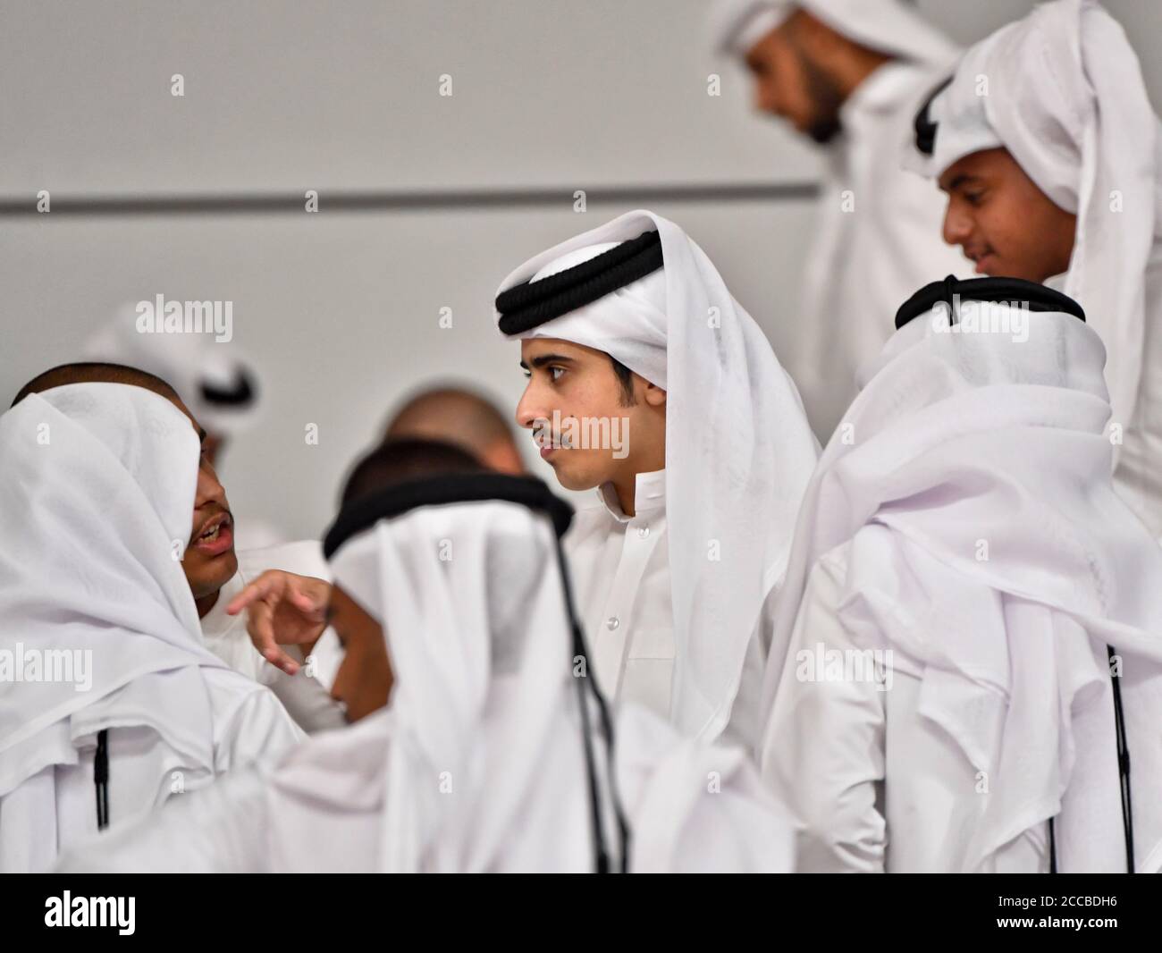 Saudi men at the Khalifa International Stadium. Doha, Qatar Stock Photo