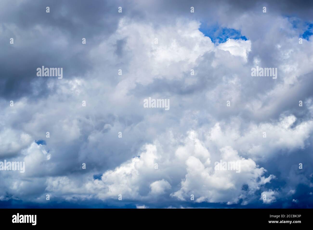 fluffy clouds in the blue sky Stock Photo - Alamy