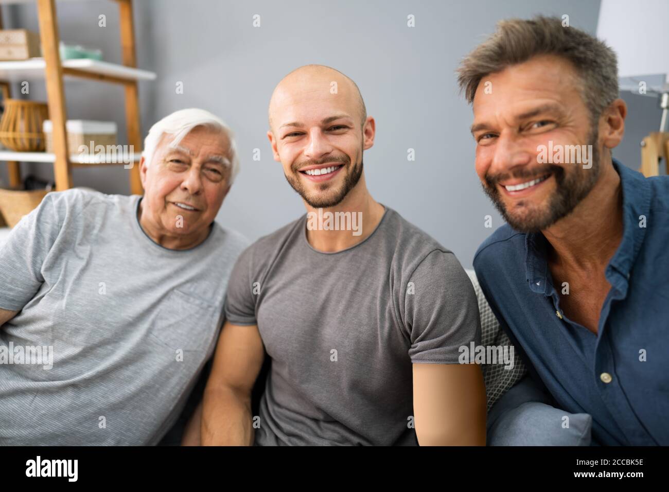 Three Generation Men Family Portraits Front View Stock Photo
