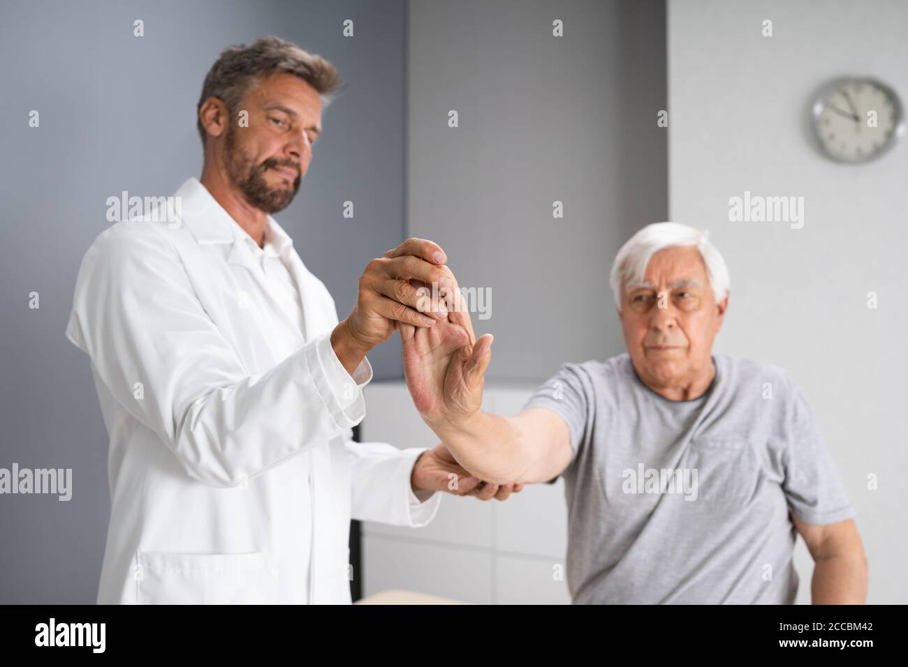 Physical Rehabilitation Therapy Exercise After Wrist Injury Stock Photo